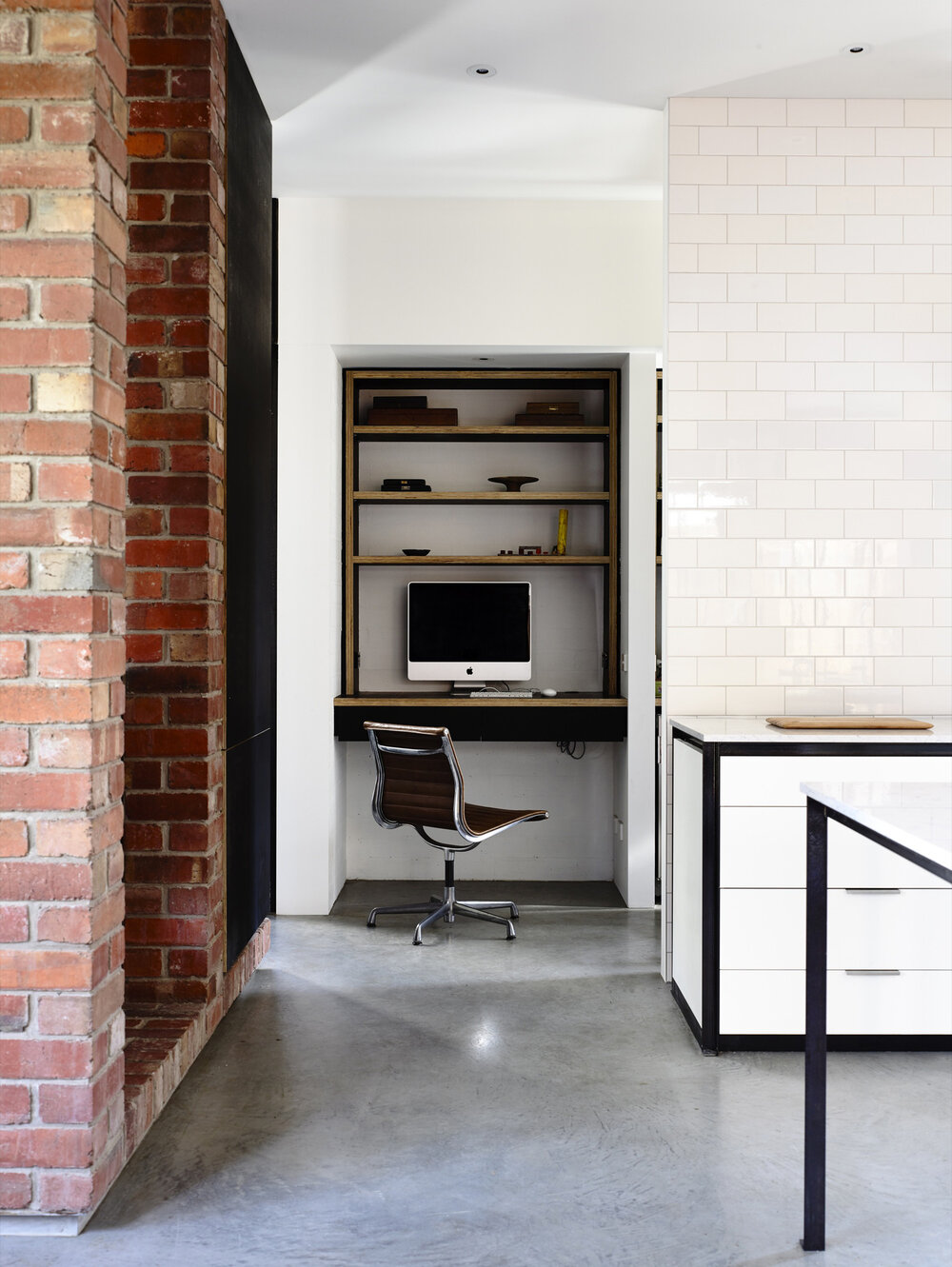 Similar to a cloffice, this micro workspace is set within a small wall opening. Designed by Wolveridge Architects. Photo by Derek Swalwell. Via  Arch Daily